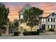 Three-story yellow house with teal shutters and a charming front porch at 197 Coming St, Charleston, SC 29403