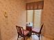 Small breakfast nook with glass table and two chairs, near window at 1955 Marsh Oak Ln, Johns Island, SC 29455