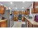 Kitchen features stainless steel appliances and ample wood cabinets at 215 Breckingridge Dr, Ladson, SC 29456
