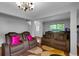 Living room with two recliners, rug, and large TV at 215 Breckingridge Dr, Ladson, SC 29456