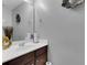 Small bathroom with single sink vanity, mirror, and dark wood cabinets at 215 Breckingridge Dr, Ladson, SC 29456