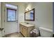 Well-appointed bathroom with a vanity, toilet, and exterior access at 614 E Cooper Ave, Folly Beach, SC 29439