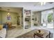 Open living area with tile floors, multiple seating options, and a bookcase at 614 E Cooper Ave, Folly Beach, SC 29439