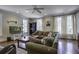 Spacious living area with hardwood floors and sectional sofa at 614 E Cooper Ave, Folly Beach, SC 29439
