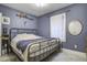 Serene bedroom with a metal bed frame and calming wall color at 614 E Cooper Ave, Folly Beach, SC 29439