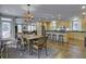 Bright dining room with hardwood floors and chandelier at 614 E Cooper Ave, Folly Beach, SC 29439