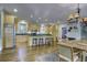 Open concept kitchen with island seating and hardwood floors at 614 E Cooper Ave, Folly Beach, SC 29439