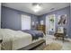 Spacious bedroom with a metal bed frame and plenty of natural light at 614 E Cooper Ave, Folly Beach, SC 29439