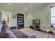 Bright and spacious media room with a comfortable couch and convenient built-in shelving at 614 E Cooper Ave, Folly Beach, SC 29439
