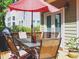 Deck features a dining set under a red umbrella, next to a grill at 3336 Toomer Kiln Cir, Mount Pleasant, SC 29466