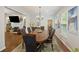Spacious dining room with hardwood floors, large table, and views to living room at 3336 Toomer Kiln Cir, Mount Pleasant, SC 29466