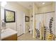 Main bathroom with shower/tub combo, updated vanity and tiled floor at 3336 Toomer Kiln Cir, Mount Pleasant, SC 29466