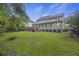 Large backyard with grassy area, deck, and privacy fence at 3336 Toomer Kiln Cir, Mount Pleasant, SC 29466