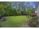 Large backyard with lush green grass and wooden fence at 3336 Toomer Kiln Cir, Mount Pleasant, SC 29466