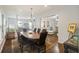 Elegant dining room with oval table, hardwood floors and view into Gathering room at 3336 Toomer Kiln Cir, Mount Pleasant, SC 29466