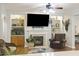 Cozy living room featuring a fireplace, built-in shelving, and a large TV at 3336 Toomer Kiln Cir, Mount Pleasant, SC 29466