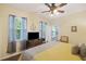 Bedroom with hardwood floors, large bed, and access to private balcony at 3336 Toomer Kiln Cir, Mount Pleasant, SC 29466