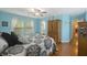 Bright bedroom with hardwood floors, a queen bed, and built-in wardrobe at 3336 Toomer Kiln Cir, Mount Pleasant, SC 29466