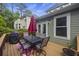 Deck with table, chairs, umbrella, and grill, overlooking backyard at 3336 Toomer Kiln Cir, Mount Pleasant, SC 29466