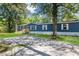 Blue mobile home with white trim, wooden deck and spacious yard at 227 Koger Dr, Summerville, SC 29483