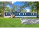 Blue mobile home with white trim and large grassy yard at 227 Koger Dr, Summerville, SC 29483