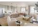 Open concept living room and kitchen with modern appliances and island at 540 Helmsman St # 1232, Daniel Island, SC 29492