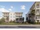 Two three-story buildings with balconies, landscaping, and palm trees at 540 Helmsman St # 1232, Daniel Island, SC 29492