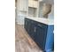 Kitchen island with dark blue cabinets and white countertop at 127 Winding Grove Ln, Moncks Corner, SC 29461