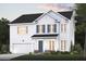 Two-story house with white siding, teal door, and a landscaped front yard at 127 Winding Grove Ln, Moncks Corner, SC 29461