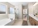 Elegant bathroom with double vanity, soaking tub, and walk-in shower at 127 Winding Grove Ln, Moncks Corner, SC 29461