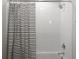 Clean bathroom with shower/tub combo and black and white striped shower curtain at 3842 Delinger Dr, Mount Pleasant, SC 29466