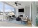 Relaxing screened porch with fireplace, seating area, and ceiling fan at 3842 Delinger Dr, Mount Pleasant, SC 29466