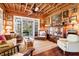 Living room with custom doors and windows, comfy seating, and wood features at 8871 Palmetto Rd # 33 Ac Private Island, Edisto Beach, SC 29438