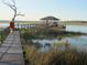 Wooden walkway leads to gazebo and pier on tranquil waterway at 8871 Palmetto Rd # 33 Ac Private Island, Edisto Beach, SC 29438