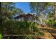 Coastal cottage surrounded by lush greenery at 8871 Palmetto Rd # 33 Ac Private Island, Edisto Beach, SC 29438