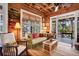 Cozy living room with a sofa and access to a screened porch at 8871 Palmetto Rd # 33 Ac Private Island, Edisto Beach, SC 29438