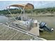 Clean pontoon boat with Yamaha motor, ready to cruise at 8871 Palmetto Rd # 33 Ac Private Island, Edisto Beach, SC 29438