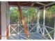Screened porch with access to roof hatch via pull-down ladder at 8871 Palmetto Rd # 33 Ac Private Island, Edisto Beach, SC 29438