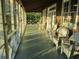 Relaxing screened porch with wicker furniture and marsh views at 8871 Palmetto Rd # 33 Ac Private Island, Edisto Beach, SC 29438