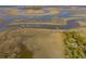 Aerial view of house on island with dock and creek at 8871 Palmetto Rd # 33 Ac Private Island, Edisto Beach, SC 29438