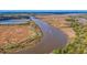 Boat on river, aerial view of waterfront property at 5565 Colonial Chatsworth Cir, North Charleston, SC 29418