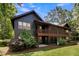 Two-story house with screened porch and landscaping at 5565 Colonial Chatsworth Cir, North Charleston, SC 29418