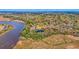 Aerial view of waterfront community with houses and pond at 5565 Colonial Chatsworth Cir, North Charleston, SC 29418