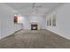 Spacious living room with fireplace and neutral carpeting at 5565 Colonial Chatsworth Cir, North Charleston, SC 29418