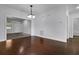Open concept dining room with hardwood floors and chandelier at 5565 Colonial Chatsworth Cir, North Charleston, SC 29418