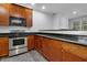Modern kitchen with stainless steel appliances and granite counters at 5565 Colonial Chatsworth Cir, North Charleston, SC 29418
