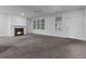 Living room with fireplace, hardwood floors, and exterior access at 5565 Colonial Chatsworth Cir, North Charleston, SC 29418