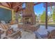 Outdoor brick fireplace with seating area at 5565 Colonial Chatsworth Cir, North Charleston, SC 29418