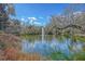 Scenic pond view with fountain and lush greenery at 5565 Colonial Chatsworth Cir, North Charleston, SC 29418
