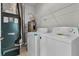 Laundry room with washer, dryer, and shelving at 5565 Colonial Chatsworth Cir, North Charleston, SC 29418